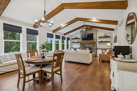 a bathroom with a granite countertop sink a mirror and a shower