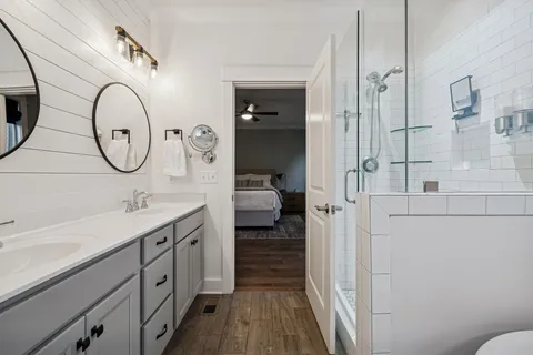 a utility room with closet and mirror