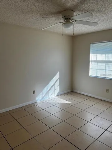 a view of an empty room and a window