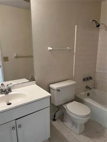 a bathroom with a sink a toilet and bathtub