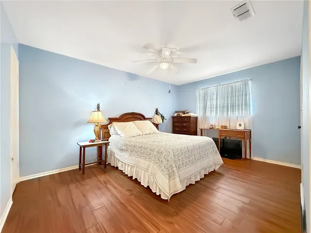 a bedroom with bed and window