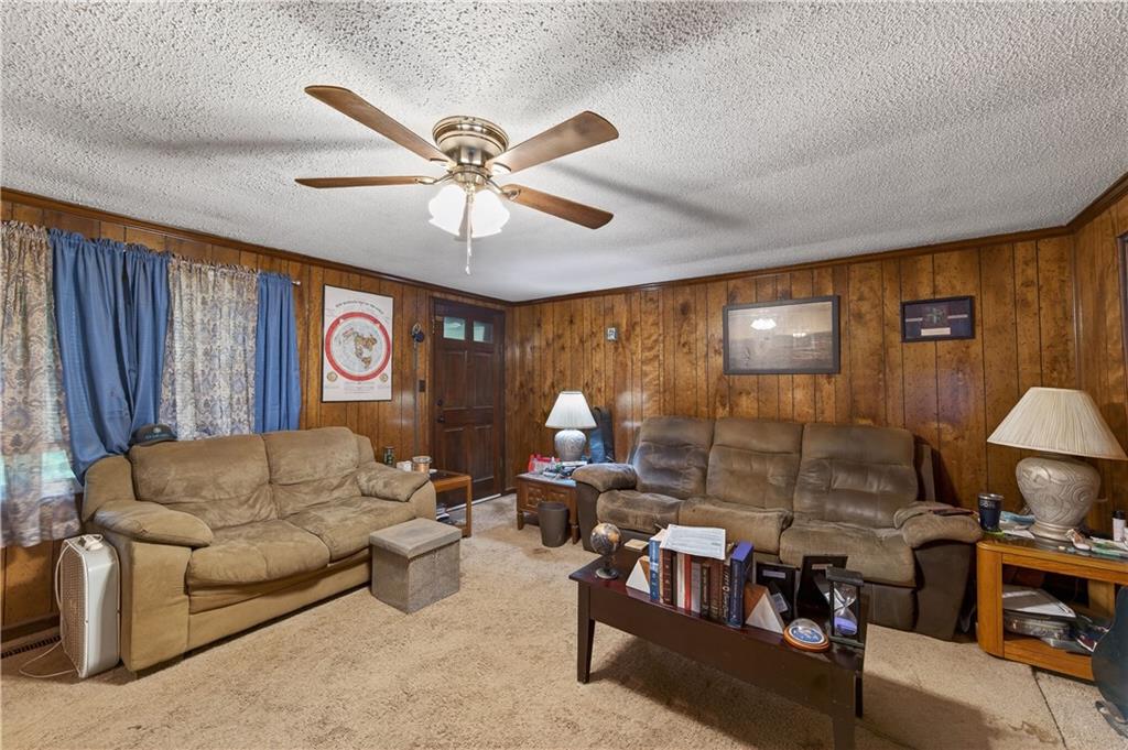 4399 Highway 411 Rydal, GA 30171 - Photo 8 of 37 a living room with furniture and a chandelier