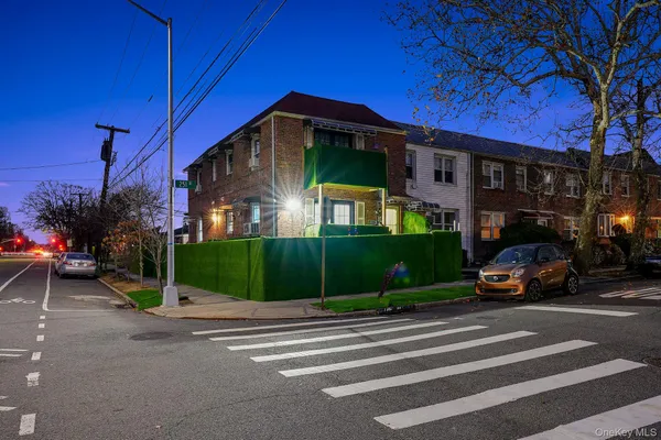 a view of a parked cars in front of a house