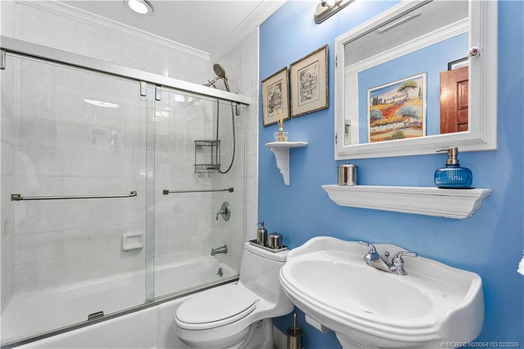 900 Northwest 11th Terrace Stuart, FL 34994 - Photo 24 of 35 a bathroom with a sink toilet and shower