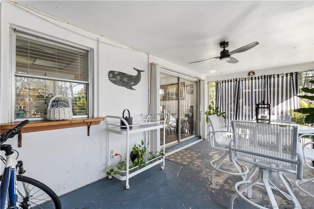 900 Northwest 11th Terrace Stuart, FL 34994 - Photo 25 of 35 a very nice looking room with a large window and potted plants