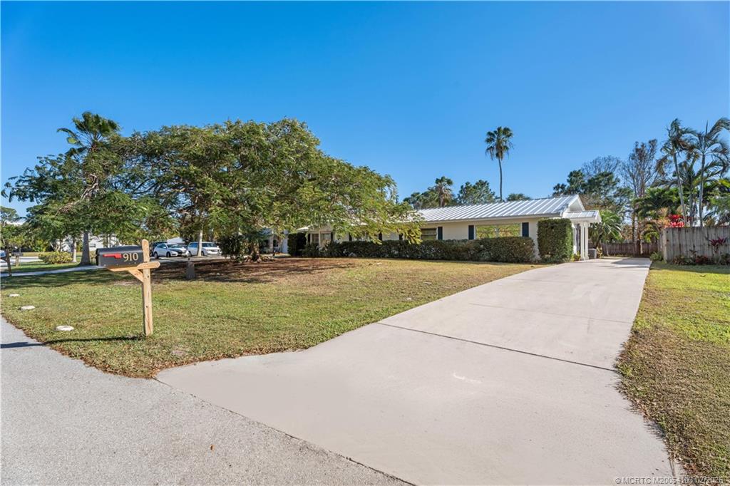 900 Northwest 11th Terrace Stuart, FL 34994 - Photo 32 of 35 a view of a house with a yard