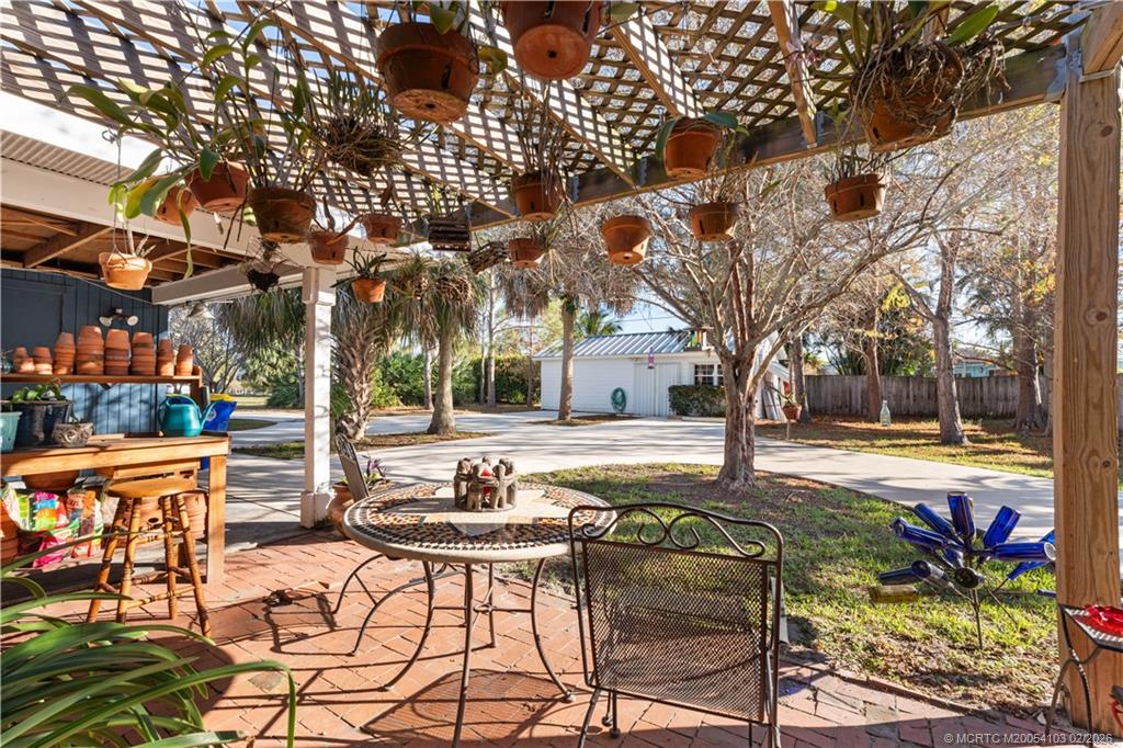 900 Northwest 11th Terrace Stuart, FL 34994 - Photo 5 of 35 a view of a chairs and tables in the patio