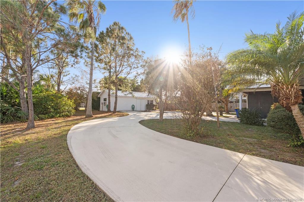900 Northwest 11th Terrace Stuart, FL 34994 - Photo 8 of 35 a view of outdoor space yard and tree