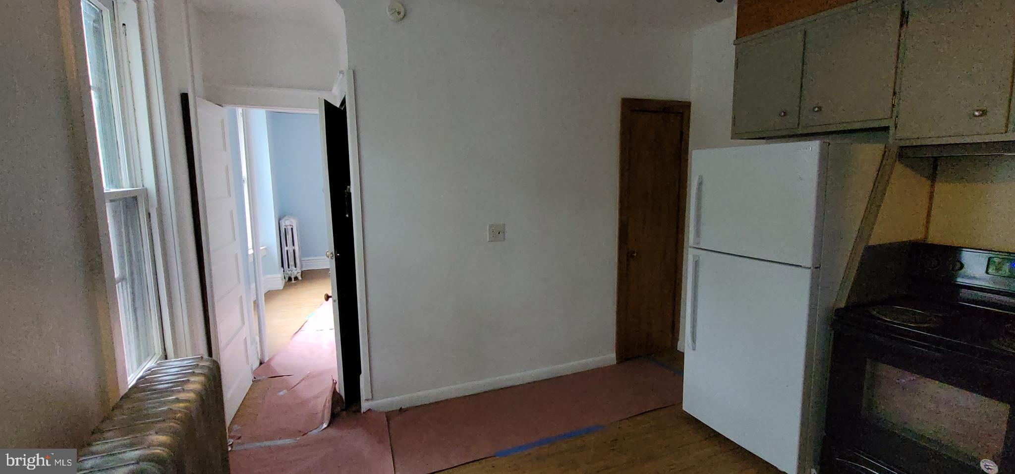 324 Spring Street, Unit 1 Reading, PA 19601 - Photo 42 of 45 a view of kitchen with furniture and refrigerator