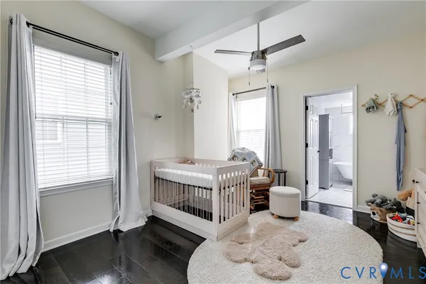 a bedroom with furniture and a window