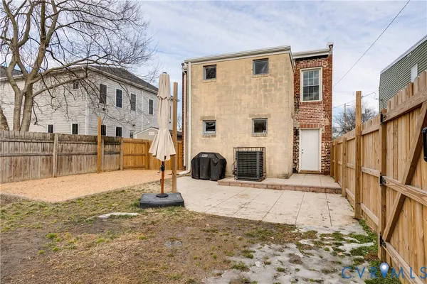 a view of a brick house with many windows