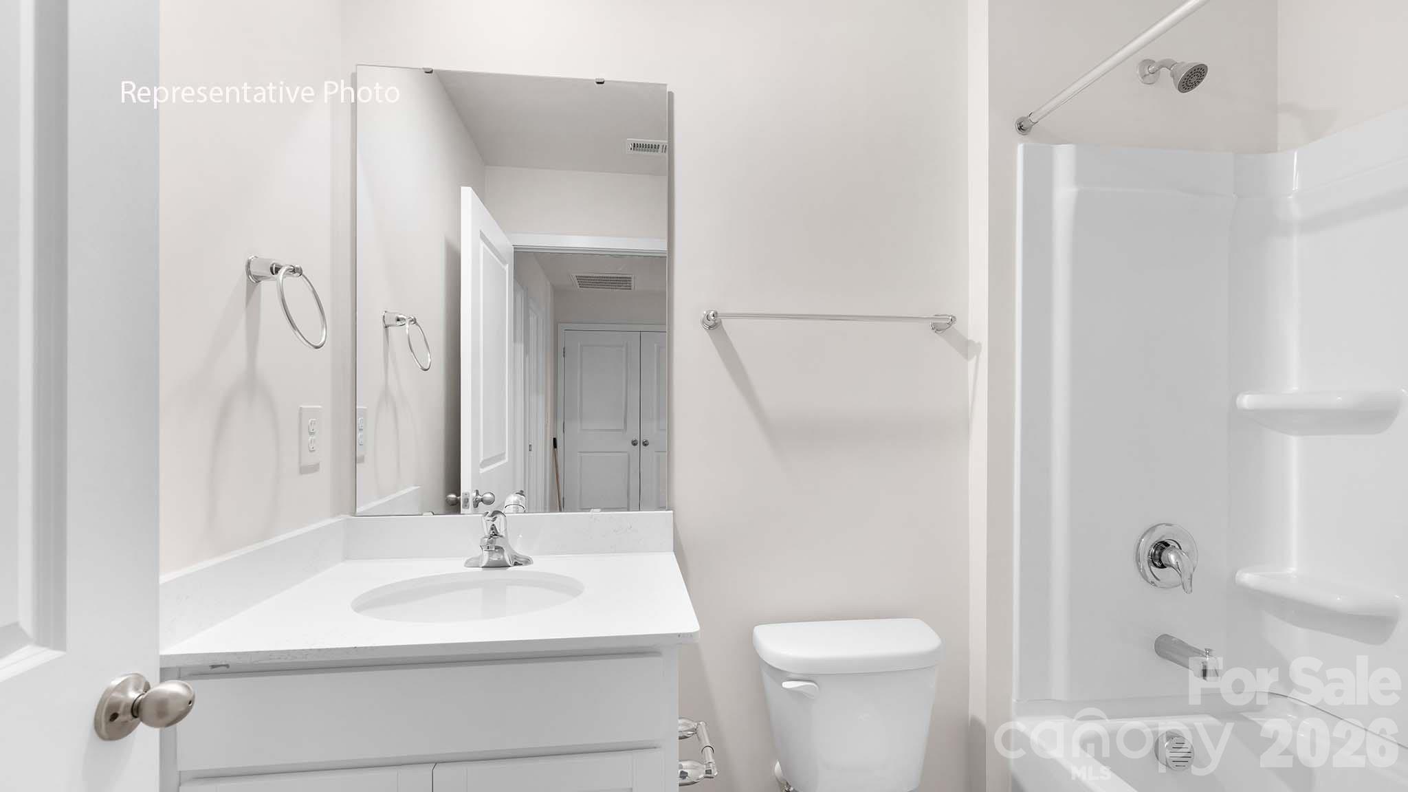 107 Parmiter Way, Unit B Troutman, NC 28166 - Photo 21 of 22 a bathroom with a sink toilet and shower