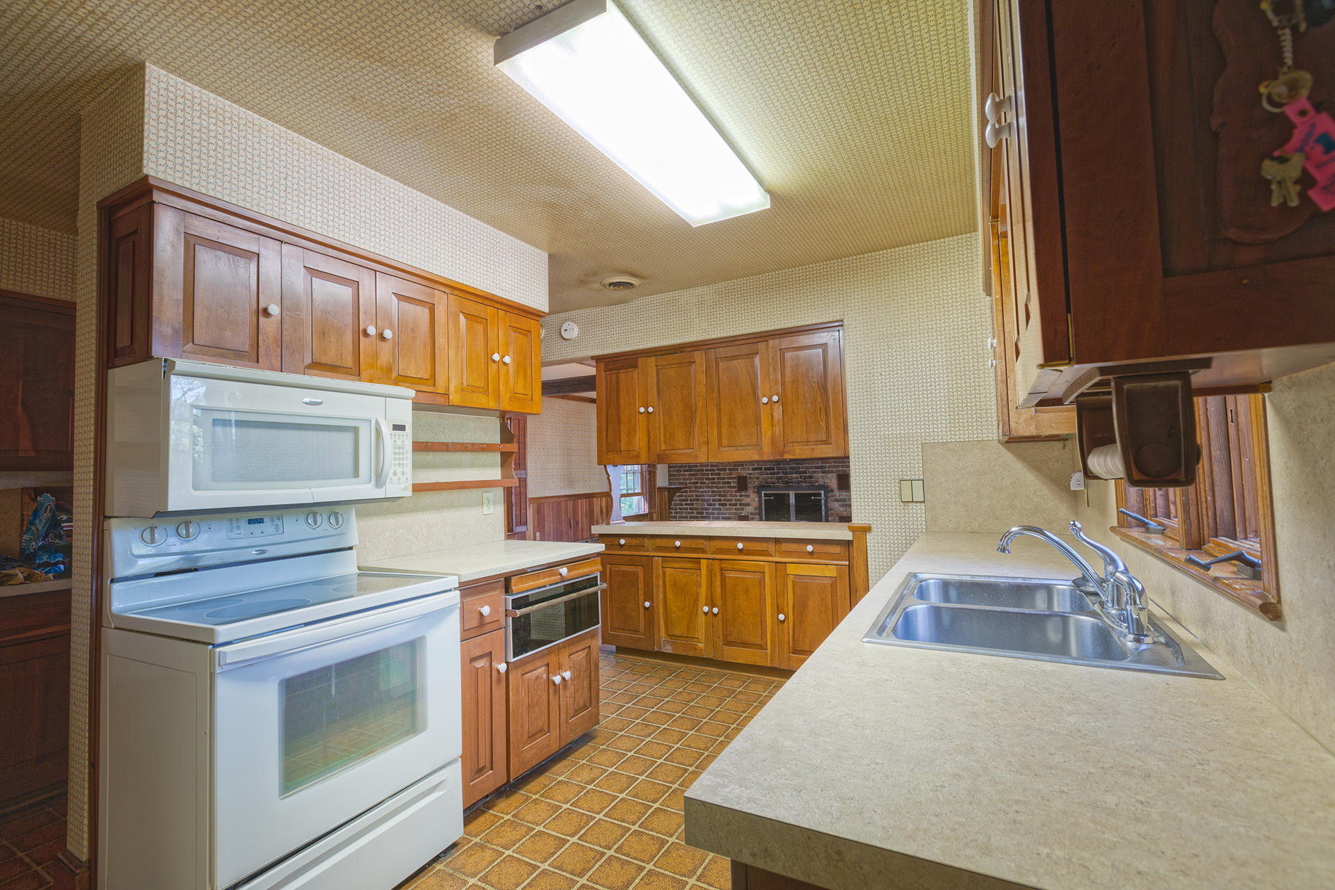 3434 West Ridge Circle Southwest Roanoke, VA 24014 - Photo 14 of 37 a kitchen with stainless steel appliances a stove sink and cabinets