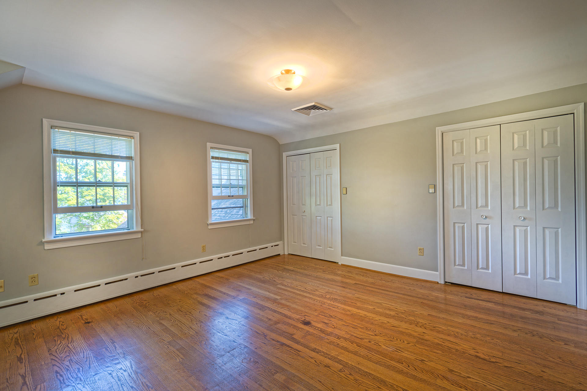 3434 West Ridge Circle Southwest Roanoke, VA 24014 - Photo 20 of 37 an empty room with wooden floor and windows