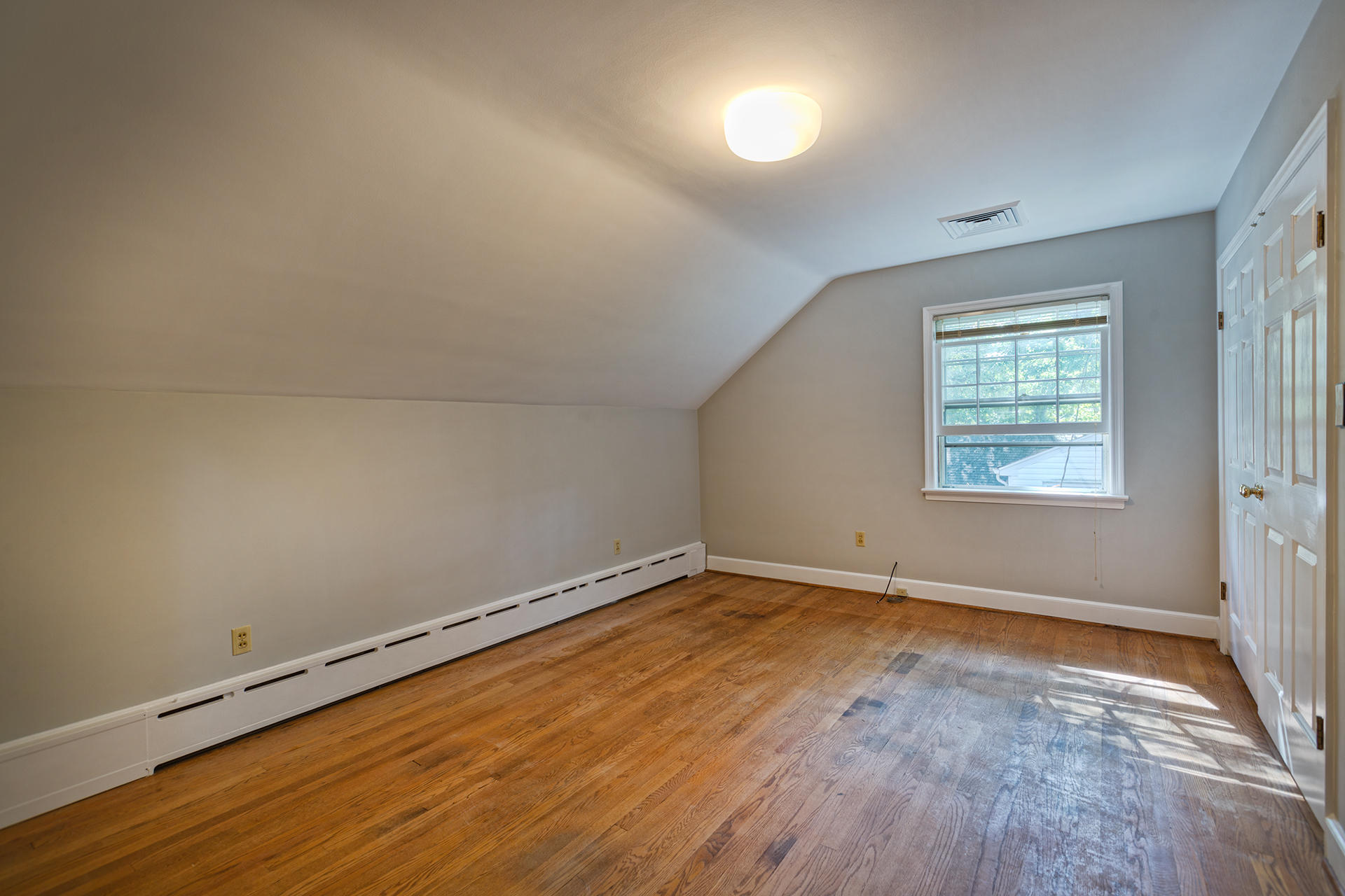 3434 West Ridge Circle Southwest Roanoke, VA 24014 - Photo 22 of 37 an empty room with wooden floor and windows