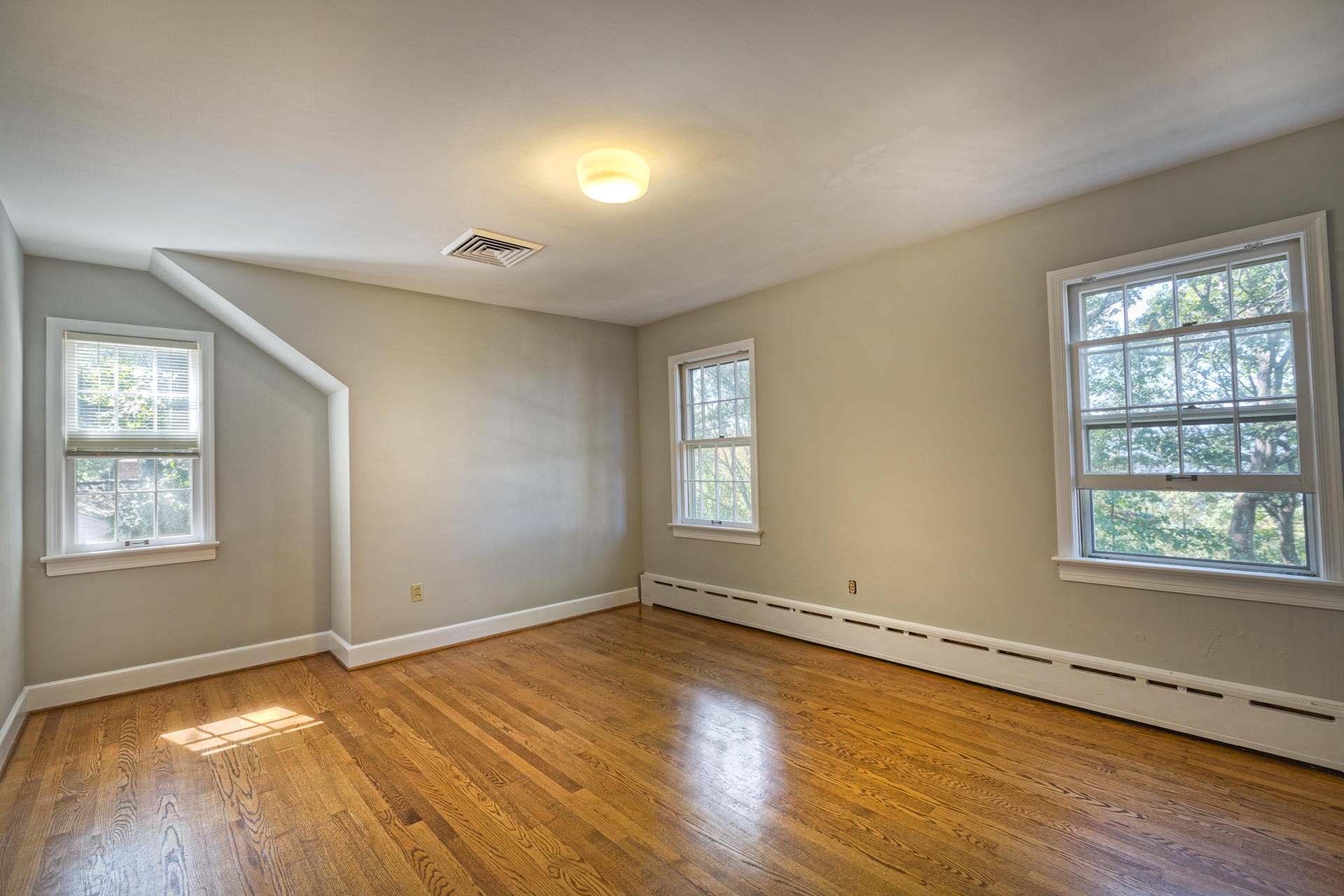 3434 West Ridge Circle Southwest Roanoke, VA 24014 - Photo 23 of 37 an empty room with wooden floor and windows