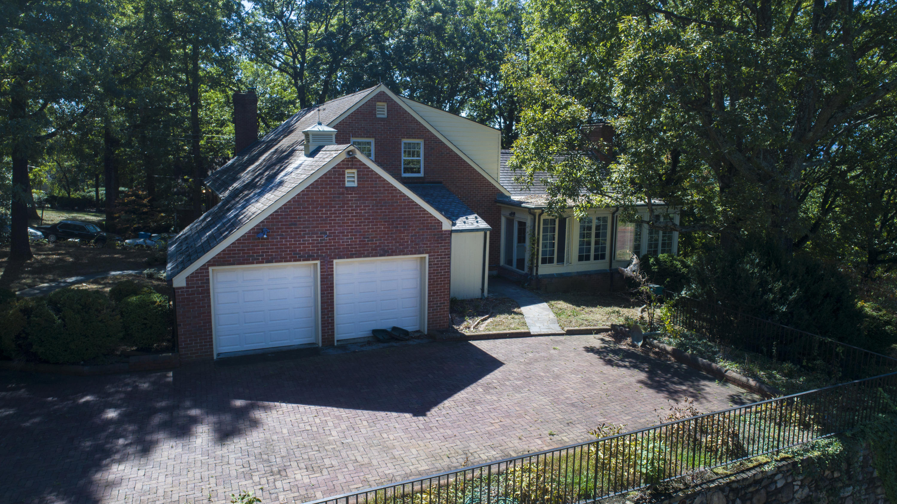 3434 West Ridge Circle Southwest Roanoke, VA 24014 - Photo 28 of 37 a front view of a house with a yard and garage