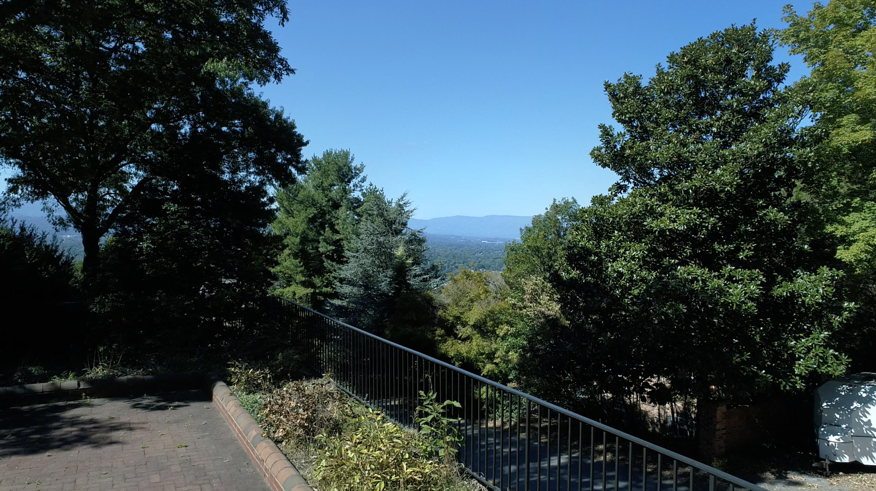 3434 West Ridge Circle Southwest Roanoke, VA 24014 - Photo 5 of 37 a balcony with lots of trees in the background