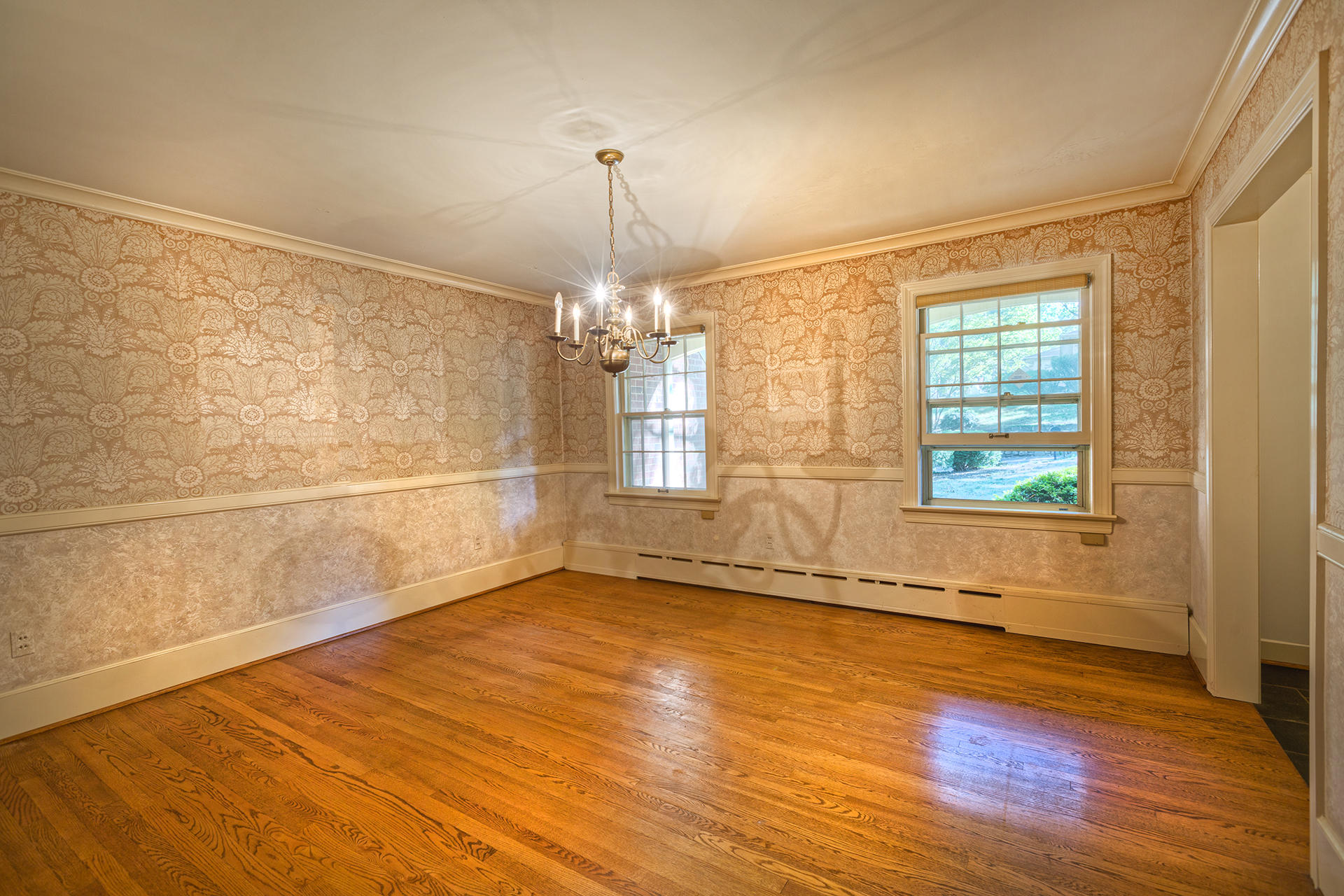 3434 West Ridge Circle Southwest Roanoke, VA 24014 - Photo 9 of 37 a view of an empty room with a window and wooden floor