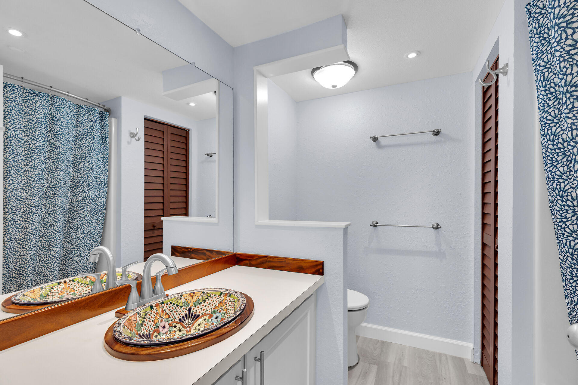 3635 Seaside Drive, Unit 206 Key West, FL 33040 - Photo 16 of 30 a bathroom with a sink and a mirror