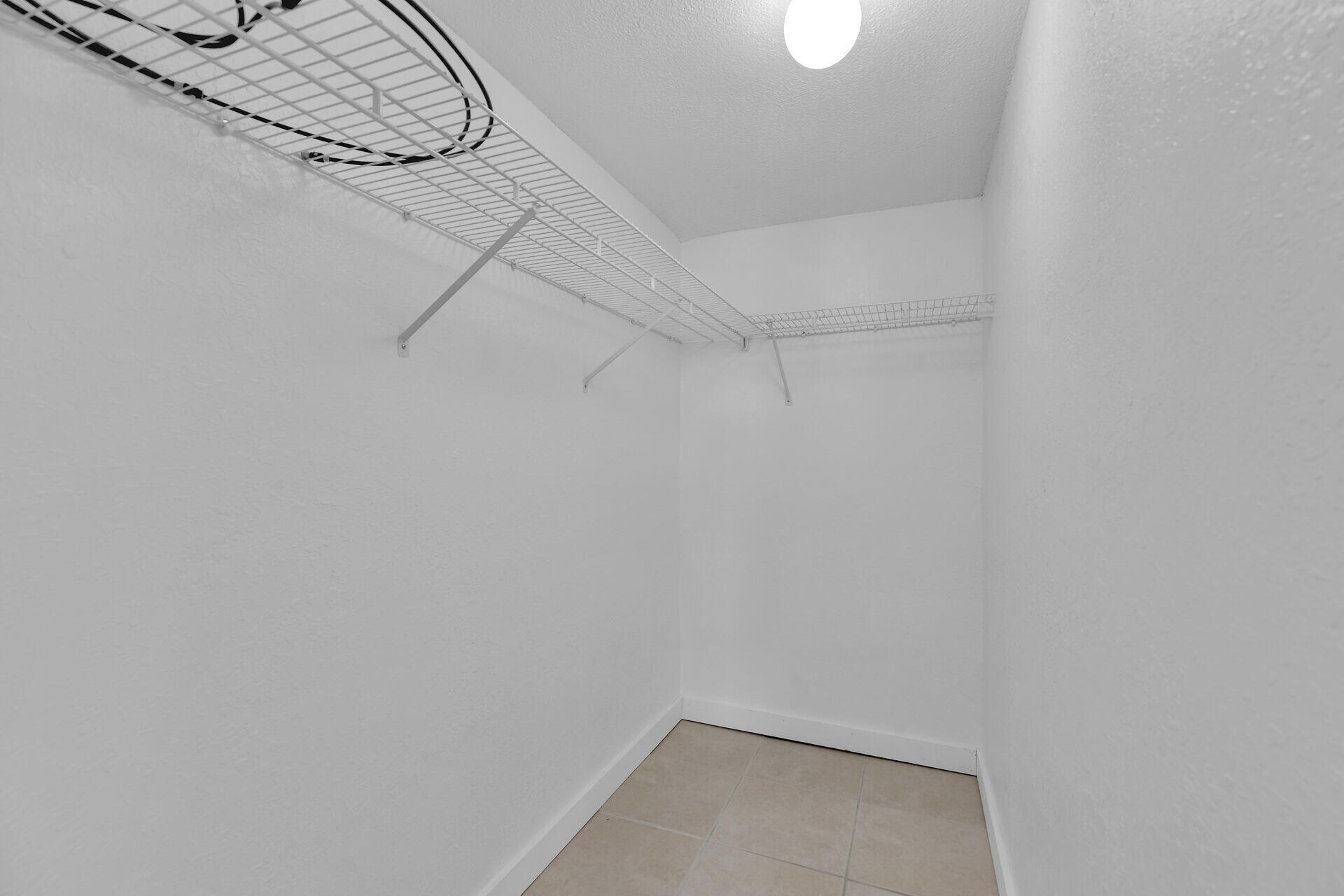 3635 Seaside Drive, Unit 206 Key West, FL 33040 - Photo 18 of 30 a view of a room with racks on the wall