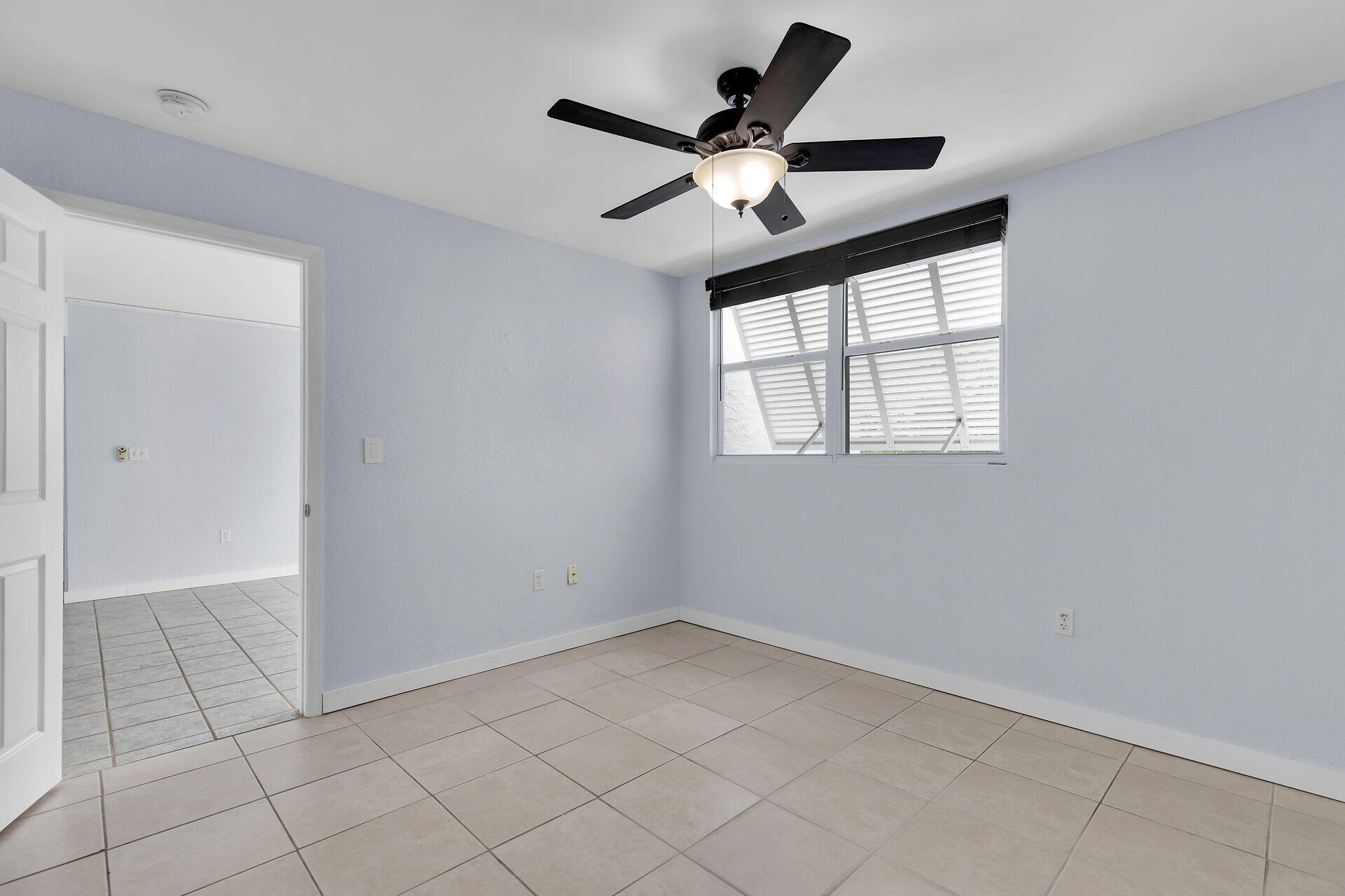 3635 Seaside Drive, Unit 206 Key West, FL 33040 - Photo 20 of 30 an empty room with windows and fan