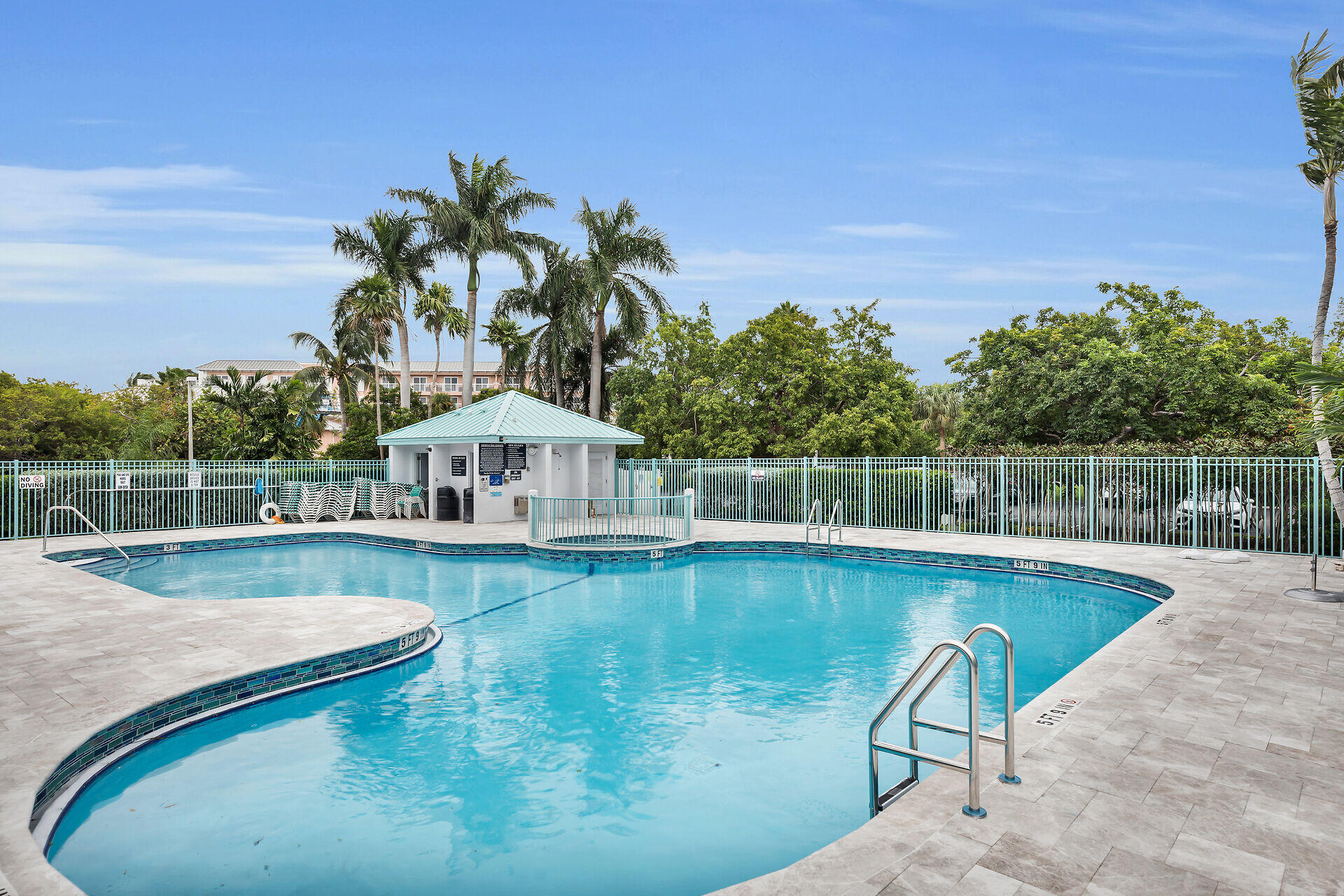 3635 Seaside Drive, Unit 206 Key West, FL 33040 - Photo 4 of 30 a view of a swimming pool with a yard