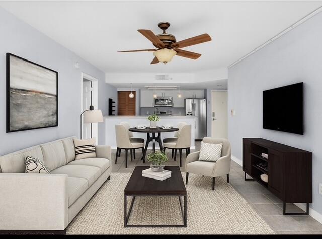 3635 Seaside Drive, Unit 206 Key West, FL 33040 - Photo 7 of 30 a living room with furniture a flat screen tv and a window