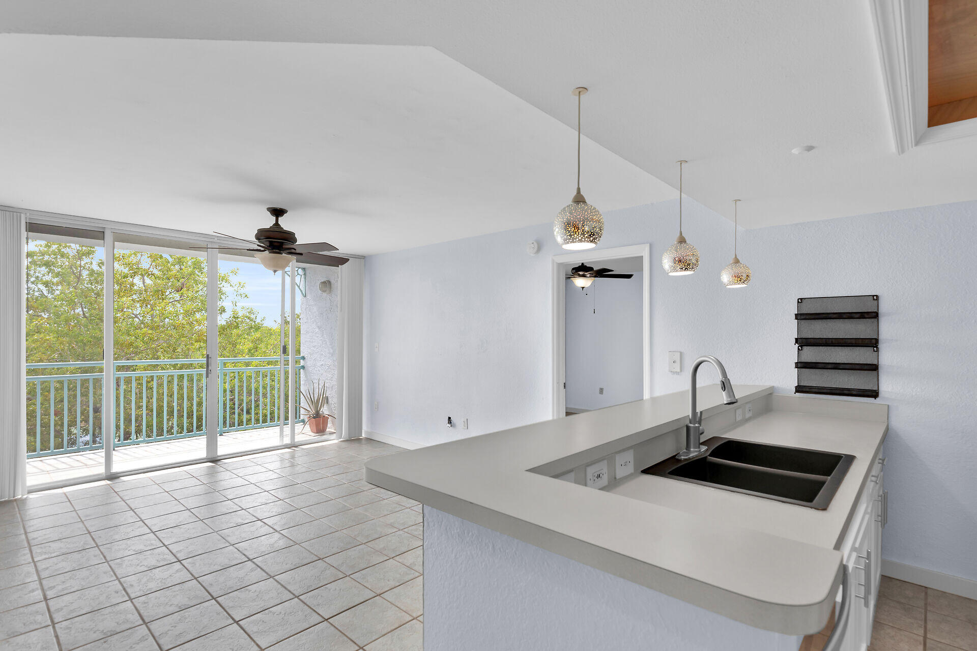 3635 Seaside Drive, Unit 206 Key West, FL 33040 - Photo 9 of 30 a view of a kitchen with a sink and windows