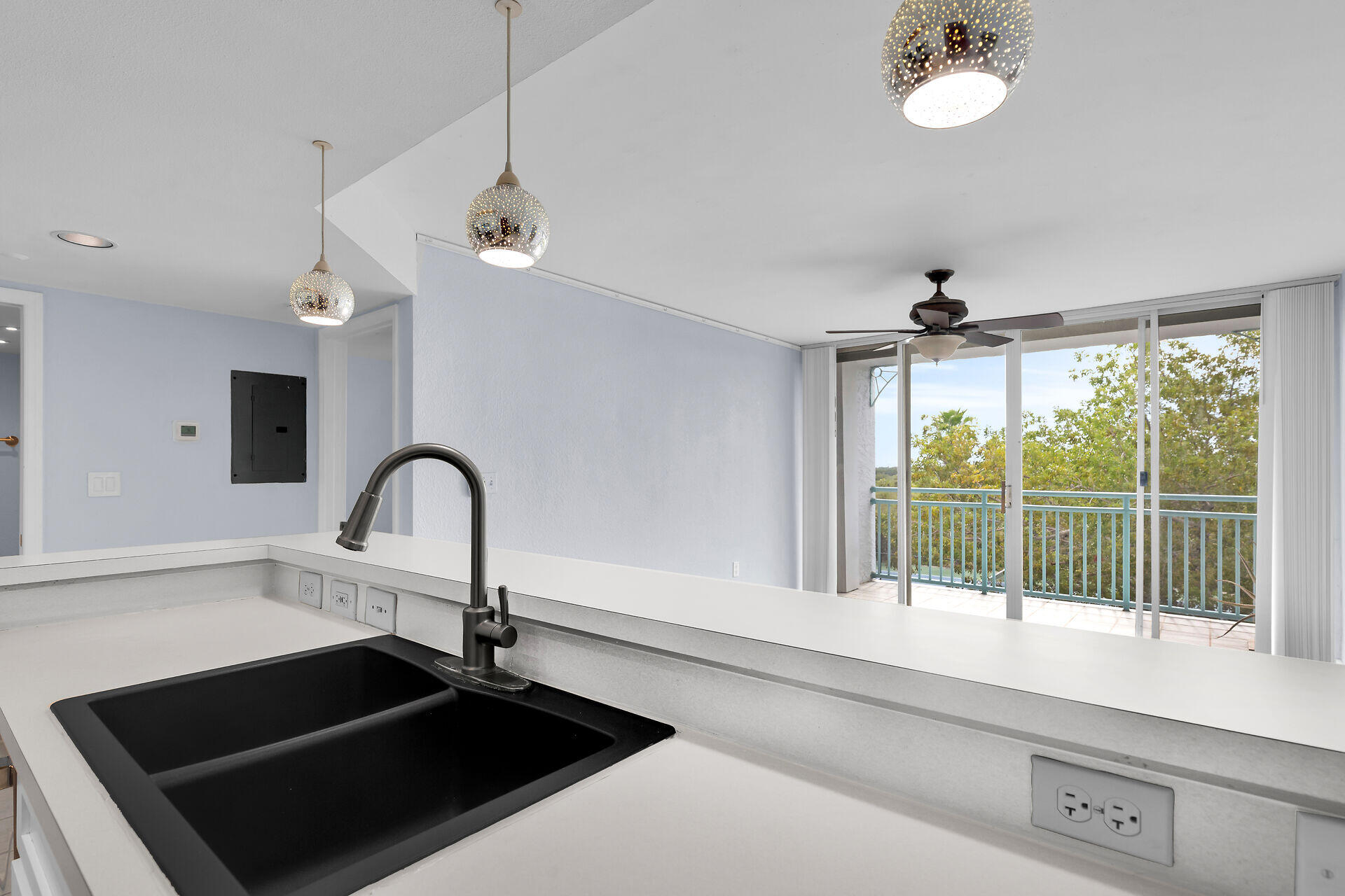 3635 Seaside Drive, Unit 206 Key West, FL 33040 - Photo 10 of 30 a close view of a sink and dishwasher with kitchen view