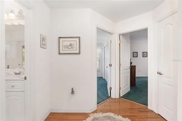 a view of a livingroom with furniture window and wooden floor