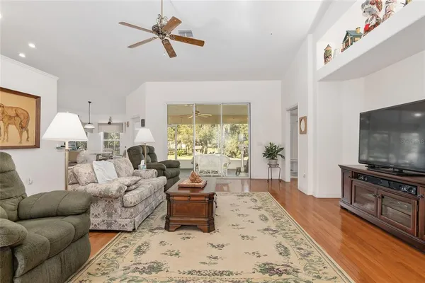 a kitchen with white cabinets and sink