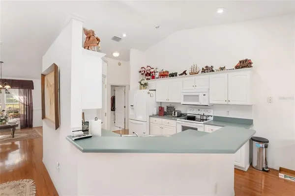 a view of a chair and tables in the backyard of the house