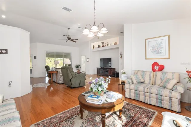 a view of a lake with houses in the back