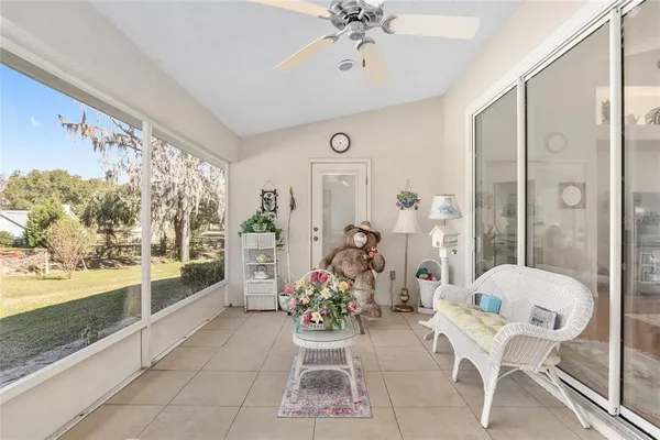 a view of a swimming pool with an outdoor space and seating area