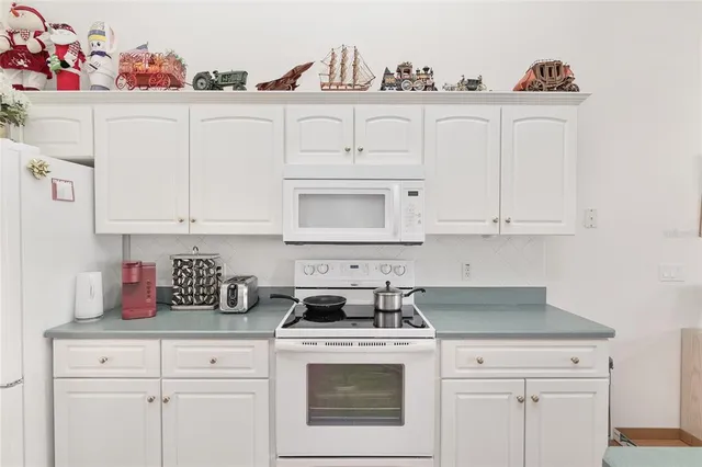 a aerial view of a house with swimming pool and ocean view