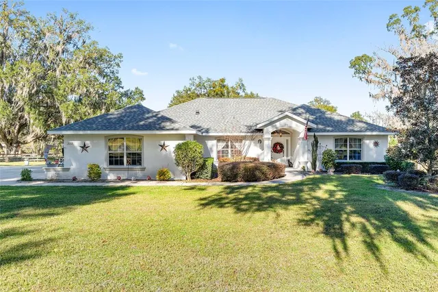 a view of a swimming pool with an outdoor space and seating area