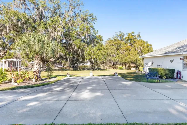 a front view of a house with a yard porch and outdoor seating