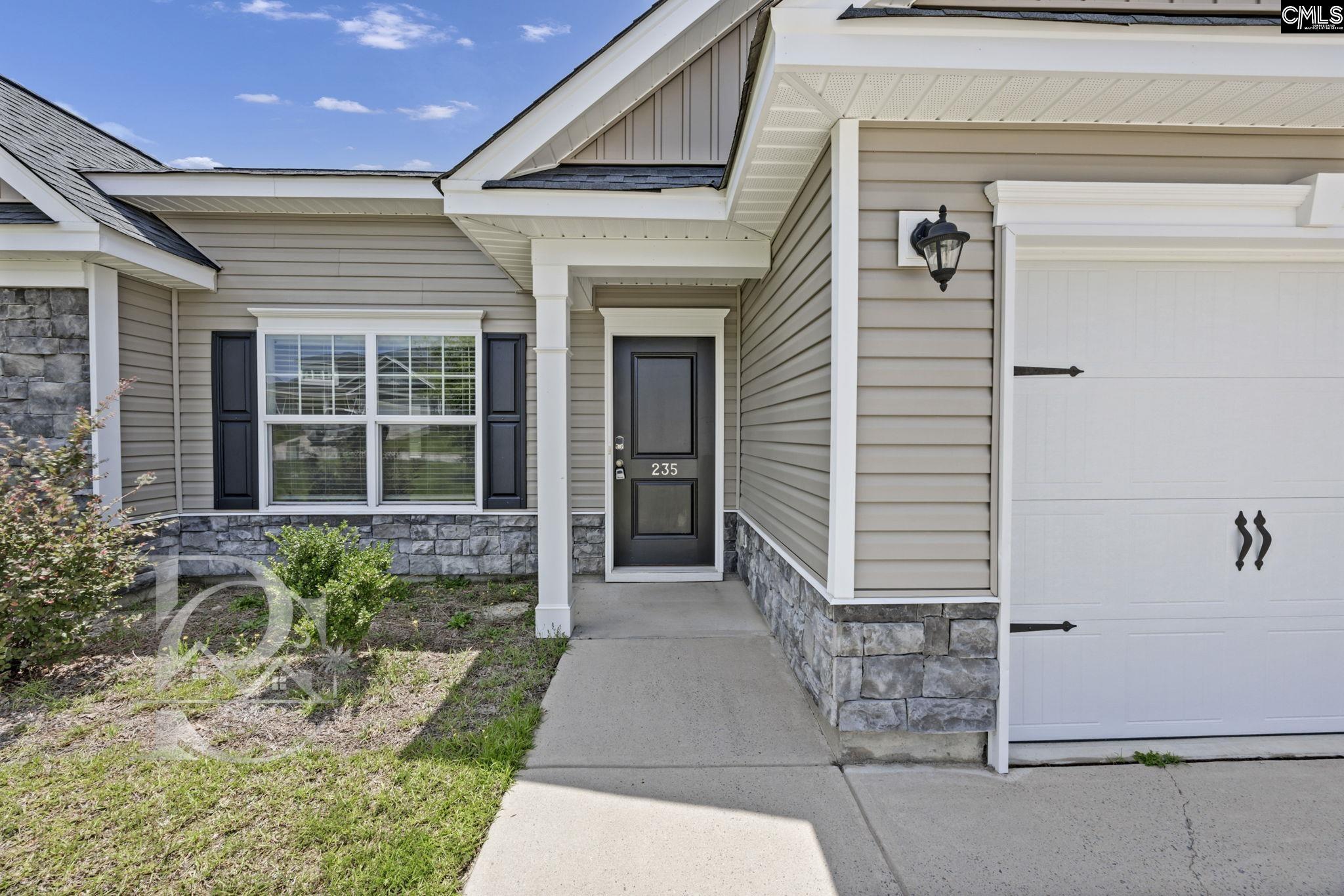 235 Drayton Hall Road West Columbia, SC 29172 - Photo 2 of 24 a front view of a house with garden