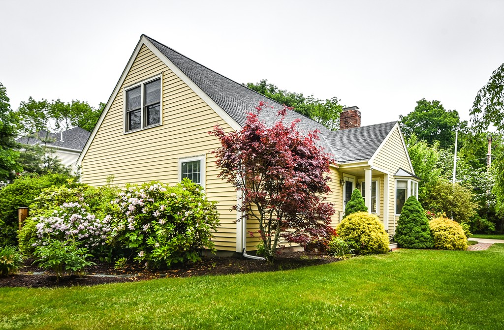 3 Woodfield Road Wellesley, MA 02482 - Photo 20 of 23 a front view of a house with a garden