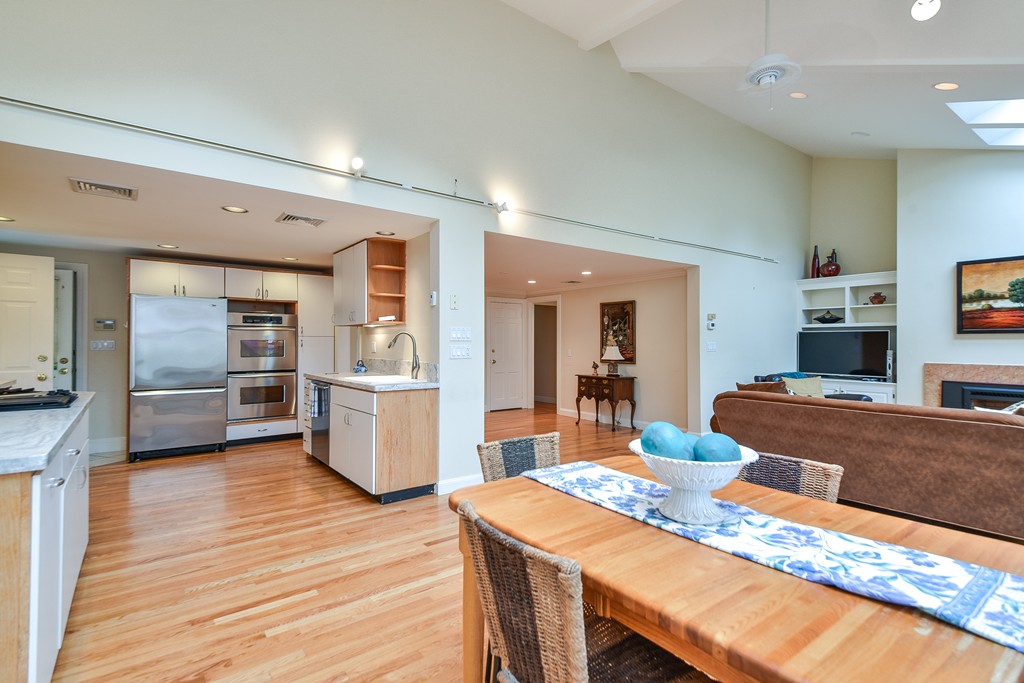 3 Woodfield Road Wellesley, MA 02482 - Photo 8 of 23 a kitchen with stainless steel appliances granite countertop a sink stove and refrigerator