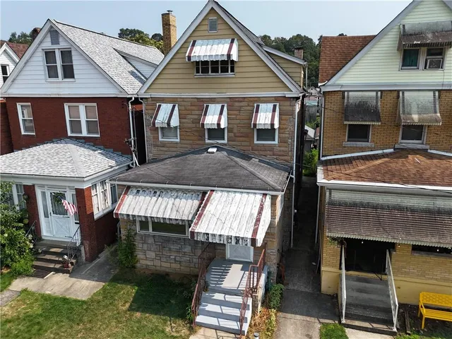 a front view of a house with garage