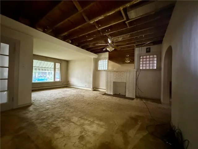 a kitchen that has a refrigerator and a stove in it