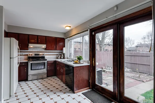 a bedroom with a bed and a potted plant