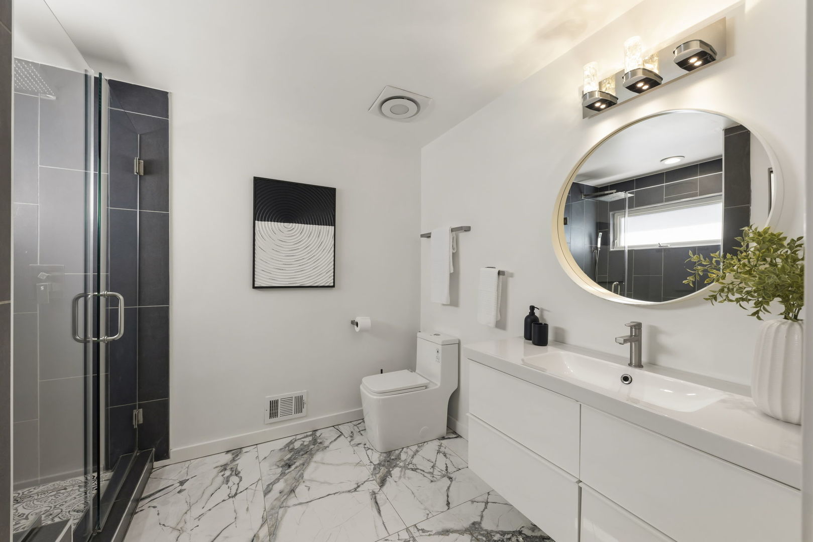 138 Chestnut Lane Bolingbrook, IL 60490 - Photo 14 of 26 a bathroom with a toilet sink and mirror