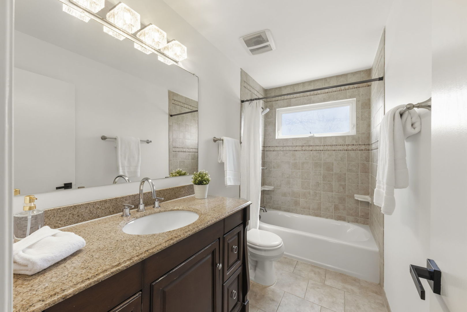 138 Chestnut Lane Bolingbrook, IL 60490 - Photo 19 of 26 a bathroom with a granite countertop sink toilet tub and shower