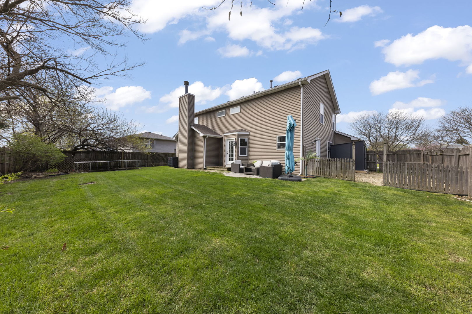 138 Chestnut Lane Bolingbrook, IL 60490 - Photo 25 of 26 a view of a house with backyard and garden