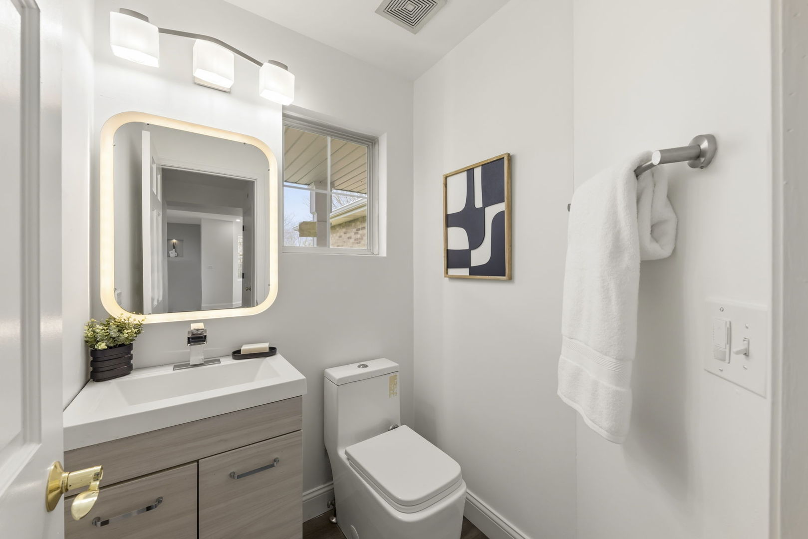 138 Chestnut Lane Bolingbrook, IL 60490 - Photo 10 of 26 a bathroom with a toilet sink and mirror