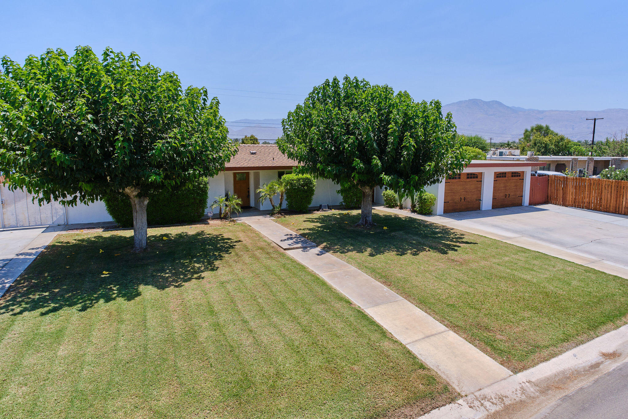 83175 Rue Paray Thermal, CA 92274 - Photo 1 of 44 a view of a house with backyard and sitting area