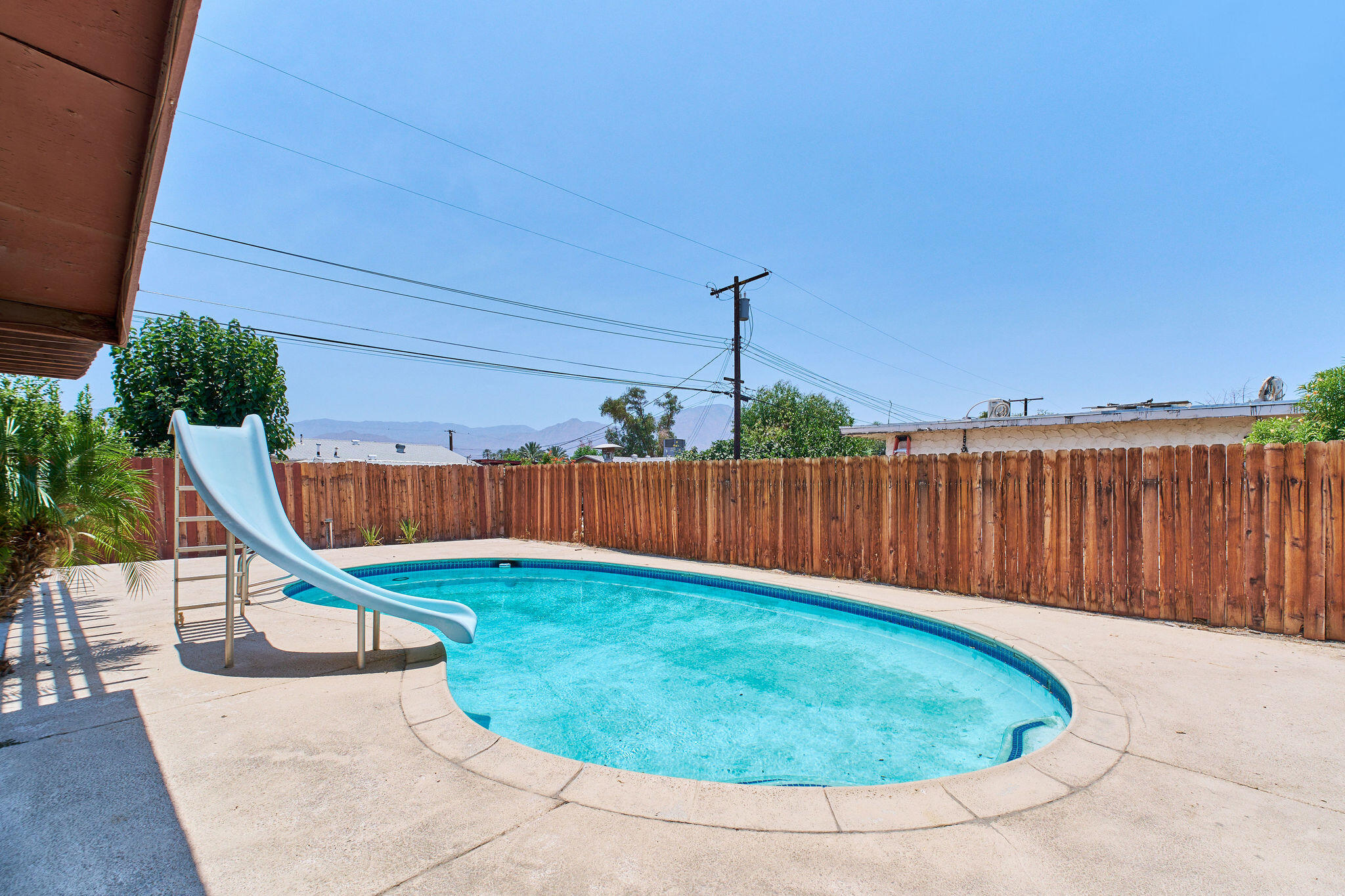 83175 Rue Paray Thermal, CA 92274 - Photo 12 of 44 a view of a backyard with a slide